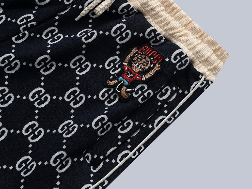 Exclusive Gucci GG Monogram Jogger Pants with Embroidered Crest — S — Detail View